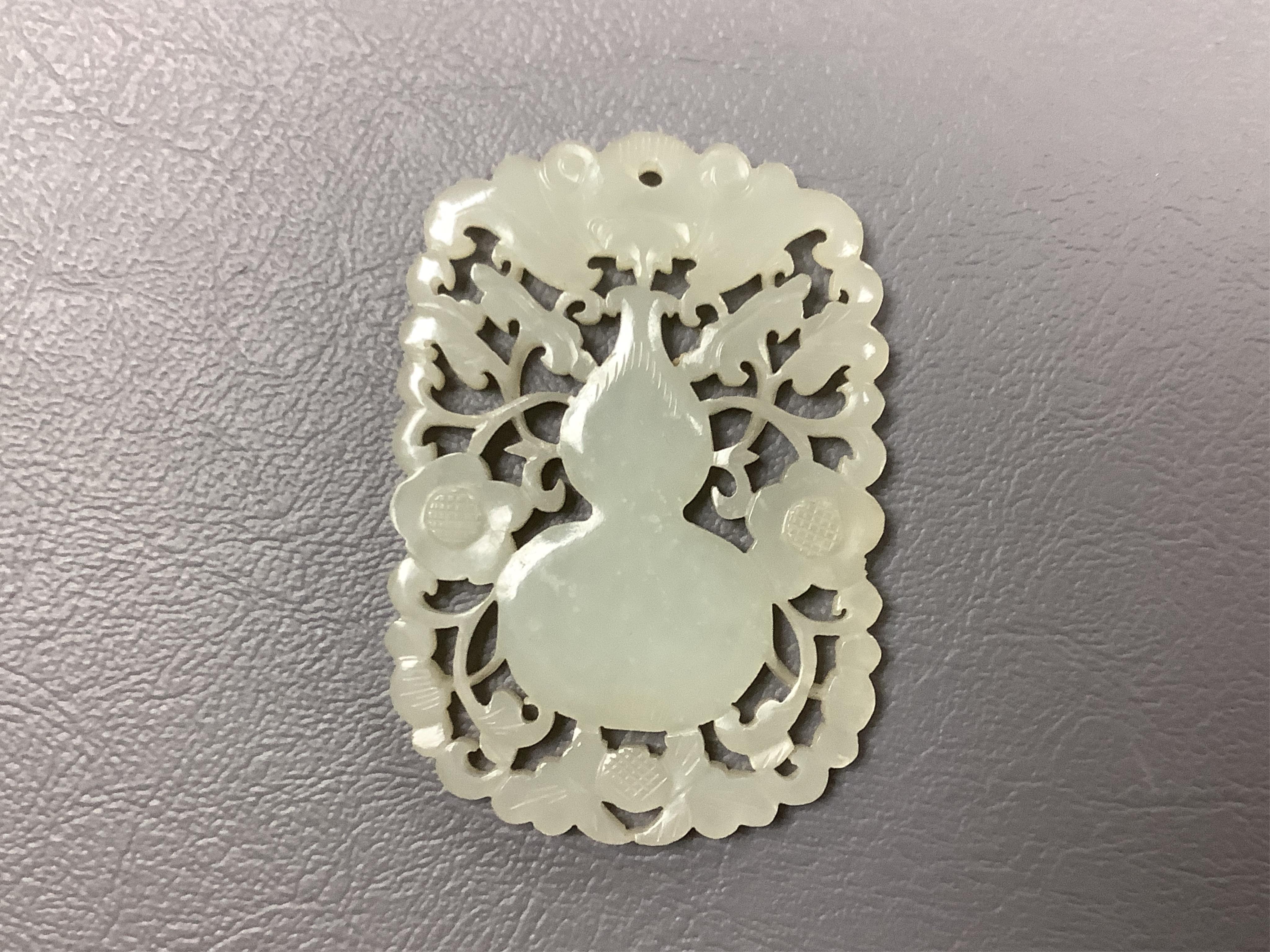 A carved jade/nephrite 19th century carving, 6cm long. Condition - good